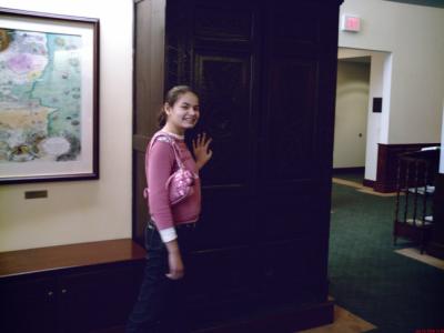 Hannah with C.S. Lewis's wardrobe at Wheaton College